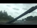 LONG CAR DRIVE ON BRITSH MOTORWAY DURING CLOUDY WEATHER