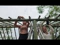 Two sisters make a roof with palm leaves, preparing for a large farm