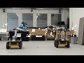 Payload-aware Trajectory Optimisation for Mobile Multi-robot Manipulation with Tip-Over Avoidance