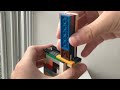 How to transfer Lego bullets from a stripper clip to a Lego magazine