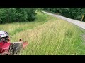 Ventrac cleaning up along a roadside