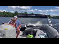 Leah driving the boat in Eagle River, Wisconsin - July 2024