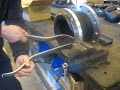 How to assemble a flange in a rubber bellow.