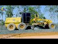 Road Construction work with a heavy machine, A motor grader working on a gravel road in the commune